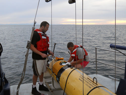 RADIO AI's hans
            thomas with undersea robot onboard vessel at sea